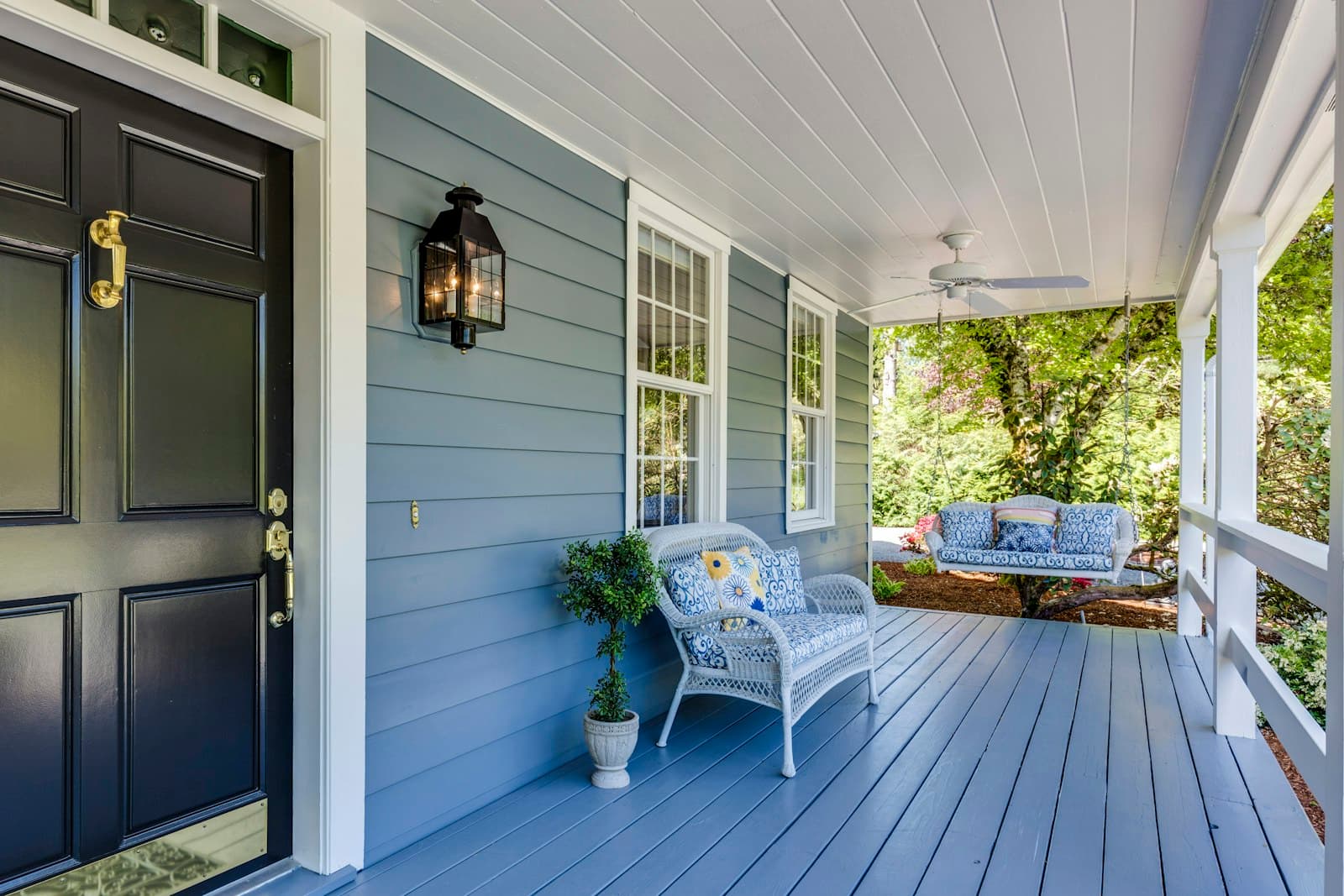 A welcoming front porch with a swing bench